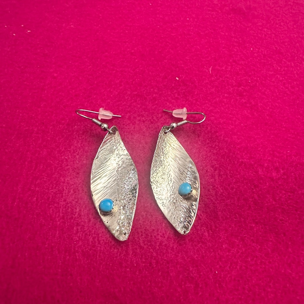 Sterling silver earrings with turquoise on each
